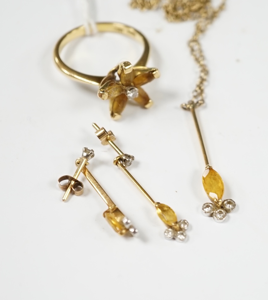 A yellow metal, citrine and diamond set suite of jewellery, comprising a ring (stamped 18ct), size O, pair of earrings, and a pendant of a 9ct chain. Condition - fair